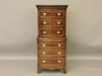 Lot 527 - A reproduction bow front mahogany chest on chest