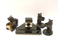 Lot 155 - Three carved Black Forest bear match and spill stands