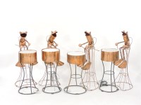 Lot 353 - A set of four hand beaten copper frog drummers