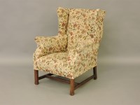 Lot 560 - Early 20th century wing back armchair