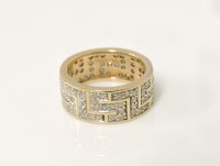 Lot 8 - A gold diamond Greek key set band ring