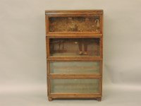 Lot 495 - A four section oak glass Wernicke bookcase