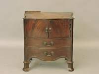 Lot 552 - A George III mahogany serpentine commode