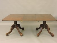 Lot 572 - A George IV/William IV mahogany twin pillar dining table