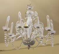 Lot 392 - An eight light glass chandelier