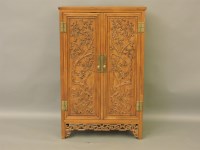 Lot 506 - A Chinese mahogany cabinet