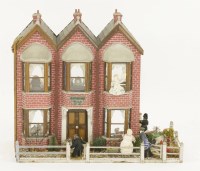 Lot 169 - An early 20th century triple fronted doll's house