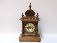 Lot 320 - A late 19th century German walnut mantel clock