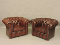 Lot 430 - A pair of oxblood leather Chesterfield armchairs