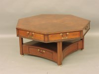 Lot 510 - An Arthur Brett septagonal low mahogany rent table