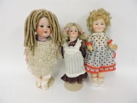 Lot 243 - An early 20th century bisque headed doll