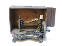 Lot 323 - A Victorian cast iron sewing machine