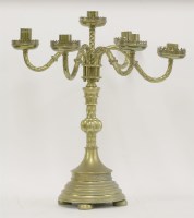 Lot 392 - A Victorian Gothic Revival brass six light table candelabra