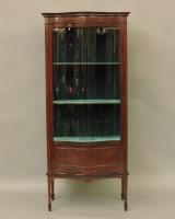 Lot 581 - An early 20th century serpentine fronted vitrine