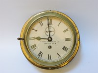 Lot 333 - A brass ship's bulkhead clock