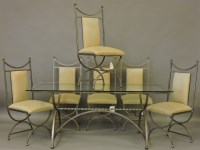 Lot 404 - A modern iron and glass dining suite