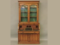 Lot 334 - A Victorian oak cylindrical bureau bookcase