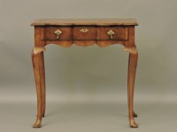 Lot 419 - A reproduction George III style walnut shaped front side table