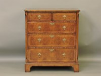 Lot 427 - A reproduction George I style walnut chest of drawers