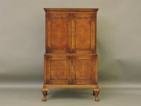 Lot 429 - A reproduction walnut cocktail cabinet