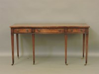 Lot 470 - A Georgian mahogany serpentine fronted serving table