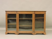 Lot 473 - An Edwardian inlaid mahogany breakfront bookcase