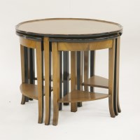 Lot 147 - An Art Deco walnut circular nest of tables