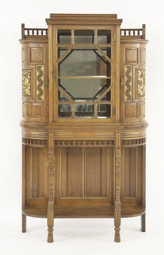 Lot 68 - An oak and parcel gilt side cabinet