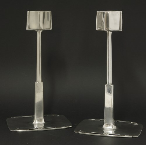 Lot 64 - A pair of 'Tudric' pewter candlesticks
