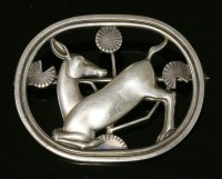 Lot 28 - A sterling silver kneeling deer brooch