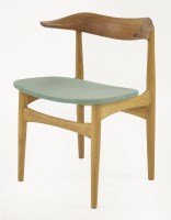 Lot 445 - An oak 'Model 521' cow horn elbow chair