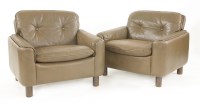 Lot 614 - A pair of Norwegian brown leather lounge armchairs