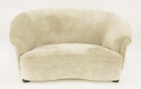 Lot 415 - A two-seater curved sofa