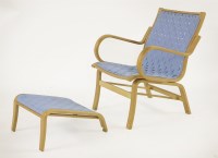 Lot 530 - A lounge chair and ottoman