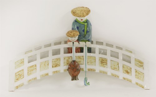 Lot 381 - A glazed and painted ceramic plaque