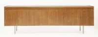 Lot 594 - A teak long sideboard