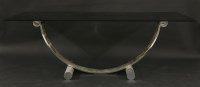 Lot 551 - A two-colour chrome dining table