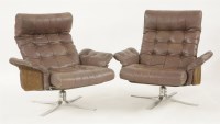 Lot 610 - A pair of leather and sueded armchairs