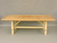 Lot 576 - A large pine and cream painted kitchen table