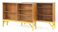 Lot 509 - A pair of teak open 'China' bookcases