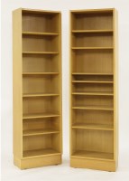 Lot 512 - A pair of Danish light oak open bookshelves