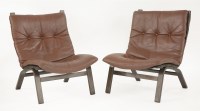 Lot 532 - A pair of beech laminate and brown leather chairs