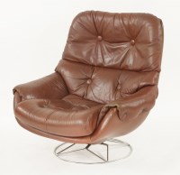 Lot 806 - A Danish tan leather revolving lounge chair