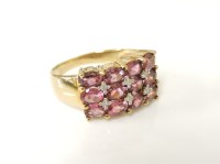 Lot 245 - A 9ct gold three row band pink tourmaline an diamond ring