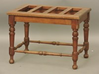 Lot 747 - A walnut luggage rack