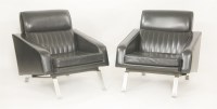 Lot 831 - A pair of black vinyl armchairs