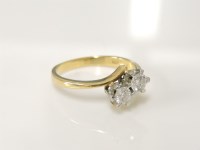 Lot 201 - An 18ct gold two stone diamond crossover ring