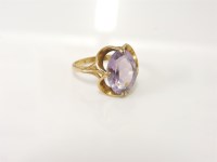 Lot 215 - A 9ct gold oval cut amethyst ring