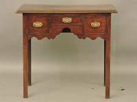 Lot 865 - A Georgian style mahogany low boy