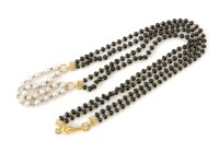 Lot 208 - A two row black glass bead and cultured pearl necklace